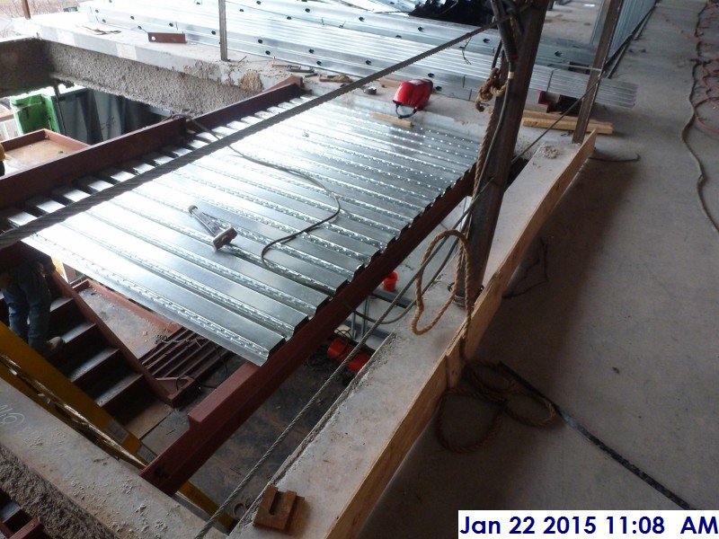 Installing metal decking at Stair -3 Facing North